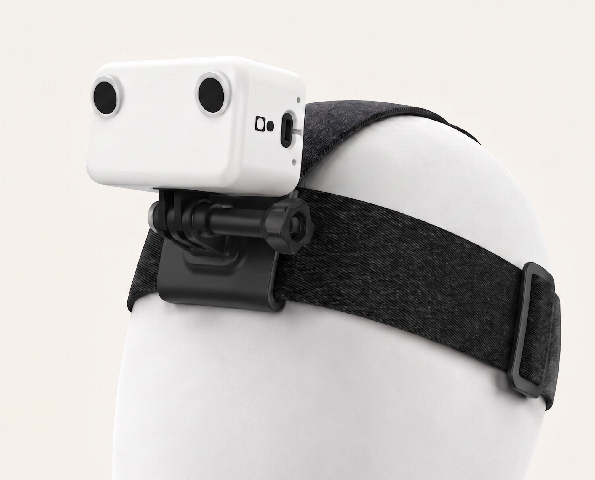 GI Ego1 worn on a head, three-quarter view showing the stereo camera module, strap, and GoPro-compatible mount